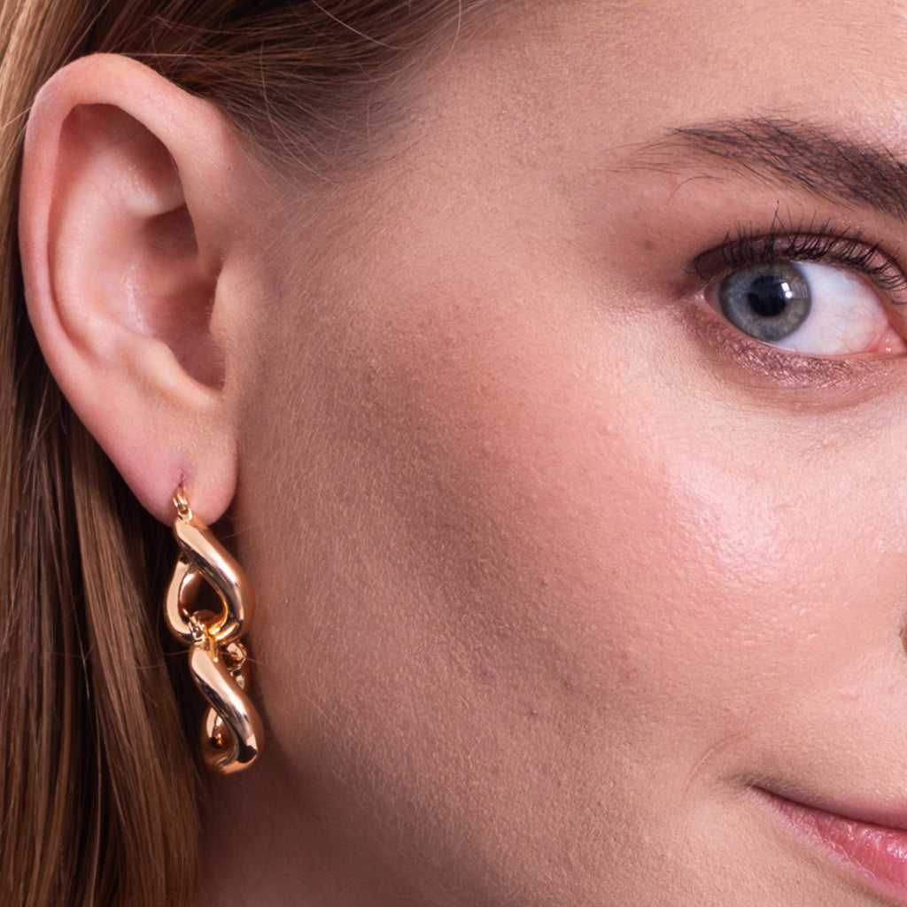 Aera Berlin Jewelry - Rhea Irregular Huggie Earring 18K Gold Plated Model Photo Left